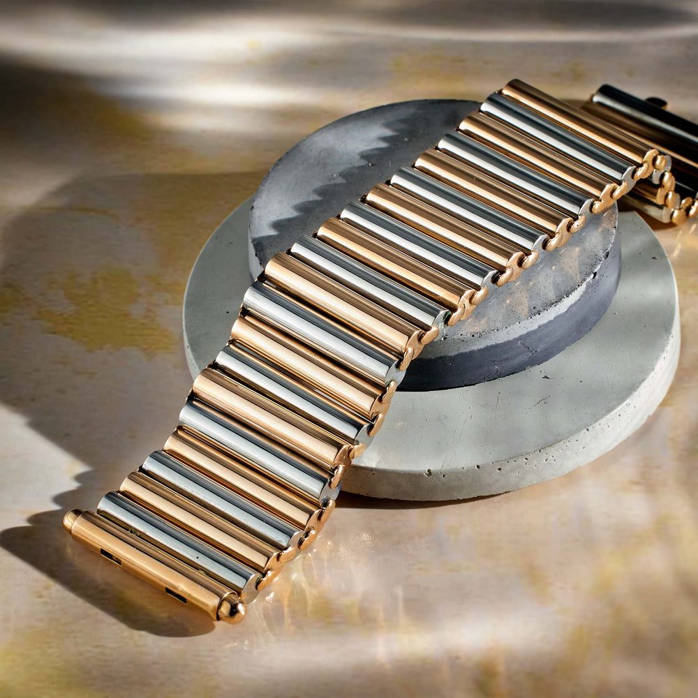 
                      
                        Bi-Color Gold Cylinder Bracelet
                      
                    